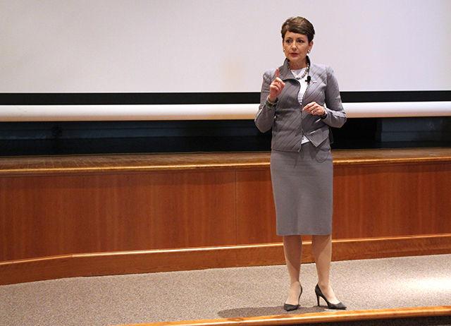 Lynn Good, President and CEO of Duke Energy, speaks on "Leading with Energy" at the Executive Lecture series organized by Poole College of Management on April 8. She discusses how meeting the demands of consumers along with caring about the environment by thinking of different sources of energy affects leadership in energy industry. She was interrupted by a protest from various students who wanted to bring attention to Energy Freedom Act, an act Duke Energy is actively against.