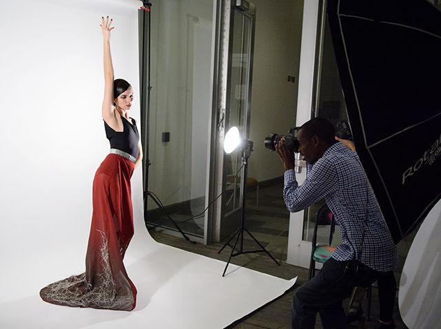 Lynn Masters, a junior studying art and design, has her photo taken backstage before lining up to walk in the Art2Wear fashion show held in Talley Student Union on April 25, 2014.