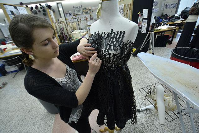Bethany Faulkner, a junior studying graphic design works on one of the pieces for the Art2wear fashion show, an annual event held by the College of Design and College of Textiles. The theme for this year is &#8220;Tell me a story.&#8221; Faulkner's collection is named &#8220;Athenaeum,&#8221; and is meant to show the visual journey of reading a book. She said she uses a lot of typography with leather and metal material using laser and plasma cutters.