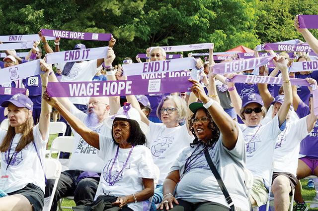 Participants of Sunday's PurpleStride 5K hold up sashes with the campaigns slogan, "Wage Hope, Fight It, End It". Pancreatic cancer is currently the fourth leading cause of cancer deaths in the United States, and one of the most poorly researched and funded. "This is why events like this are so important", said Lisa Allen of Greensboro. Hundreds of participants get a running start in Saturday morning's PurpleStride 5K on NC State's Centinennial Campus. Participants of the timed run and walk came together to Wage Hope and raise awareness about pancreatic cancer. The event, which was brought together by the Pancreatic Cancer Action Network, raised $202,512 in funds to be donated to research and to help provide personalized support for patients. Photo by: Rachel Smith