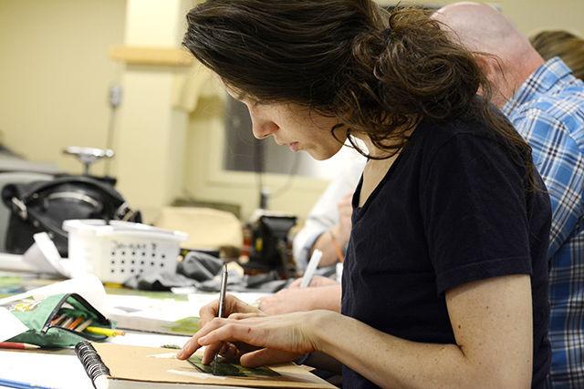 Alicia Moya-Mendez, a student at Wake Tech, is etching on nickel for designing a bracelet in a metalsmithing class at the Crafts Center Tuesday. &#160;This is the first time Moya-Mendez has taken a class at N.C. State&#8217;s Crafts Center&#160;and described her experience so far as a &#8220;very informative and fun&#8221; first class. Mary Ann Scherr, product designer and instructor of the course, said, &#8220;I enjoy teaching because I learn so much from my students.&#8221;