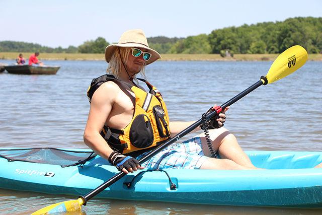 Aaron Maier, a senior studying Economics pushes his Kayak into the waters of Lake Higgison in Greensboro on Saturday evening. "Kayaking is an incredible physical activity. I hadn't done this for two years and I didn't realise how much fun it is to take the boat and paddle and just relax midst the serene nature. It gives you the ability to just go out in the sun and enjoy the ride. I would totally recommend it to everyone as a great summer activity, Maier said.
