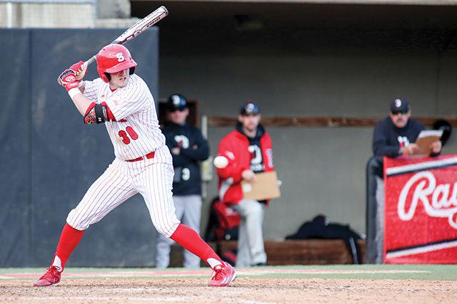 Jake Fincher, a senior outfielder, holds his swing during the baseball game against Davidson on Feb. 14 on Doak Field. Fincher had three at bats with one hit, one run and one runner batted in. The Wolfpack took down Davidson with a commanding 8-3 score.