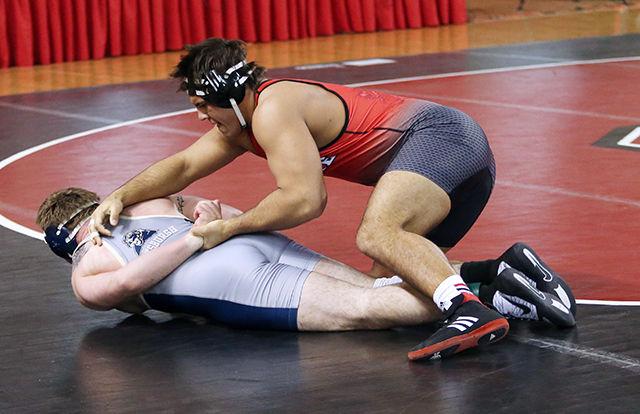Redshirt Junior Nick Gwiazdowski pins Pitt's Ryan Solomon to the floor. Gwiazdowski won the match in a blazing 1:56. NC State beat #12 Pittsburgh 27-12 during the beauty and the beast matchup.