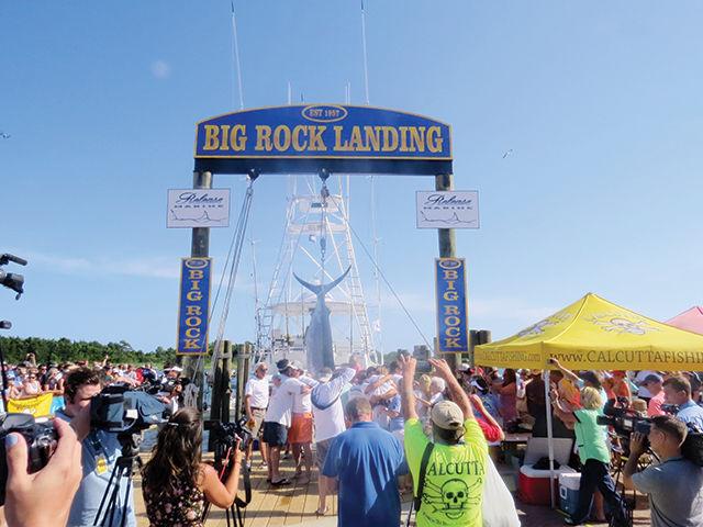 The crew of the Shenandoah celebrates after winning the $365,000 prize for boating the first blue marlin over 500 pounds in the Fabulous Fisherman division on the first day of the Big Rock Tournament on Monday.