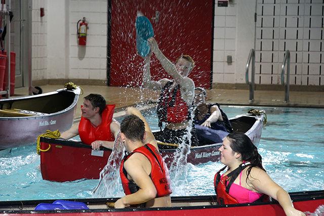 Two of the many teams who participated in pool battleship, throw water at each other to make opponents canoe sink. Pool Battleship was organized as a part of Intramural sports at Casey Aquatic Centre on Saturday, July 25, 2015.