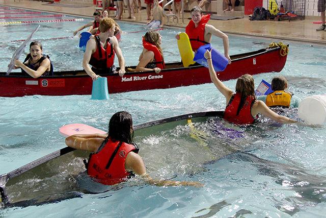 Canoe of one of the teams topples as the other teams watch them with joy. Pool Battleship was organized as a part of Intramural sports at Casey Aquatic Centre on Saturday, July 25, 2015.