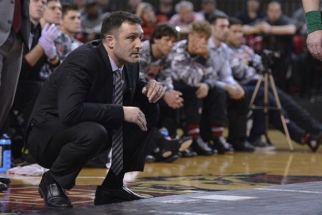 Head coach Pat Popolizio watches redshirt junior Nick Gwiazdowski wrestle during No. 20 NC State's match with No. 6 Oklahoma State Feb. 22, 2015 in Reynolds Coliseum. Despite strong performances by Gwiazdowski and redshirt freshman Joe DeAngelo, the Wolfpack was defeated by Popolizio's alma mater 20-12.