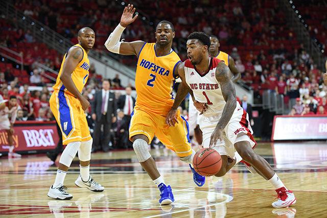 Redshirt junior guard Trevor Lacey drives to the basket during the game against Hofstra in PNC Arena Monday, Nov. 17, 2014. Lacey had a double-double in the Wolfpack's 76-64 victory over the pride with 16 points and 10 rebounds.