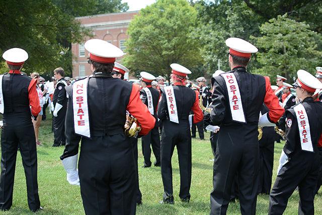 The NC State University marching band warms up before Packapalooza.