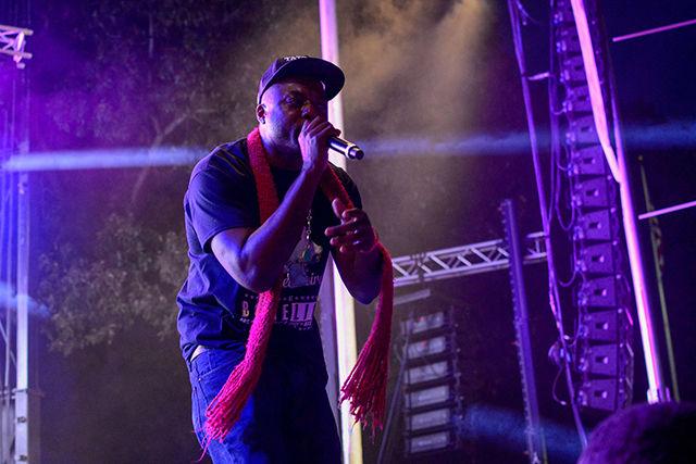 A member of Nappy Roots performs on the main stage.