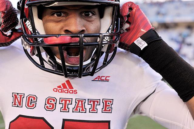 Redshirt sophomore safety Josh Sessoms celebrates following the game against North Carolina Saturday, Nov. 29, 2014. The Wolfpack had 454 total-yards in their 35-7 win over the Tar Heels at Kenan Stadium in Chapel Hill, NC.