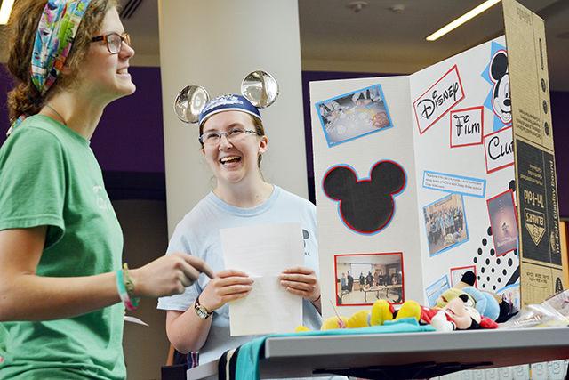 Hannalee Alrutz, a junior studying middle grades language arts &amp; social studies, talks with Hannah Carraway, a sophomore studying film and president of the Disney Film Club about the club during Campus Connections in Talley Student Union Tuesday, August 18, 2015. Alrutz was with the church student organization Grace Christian Life and came to Carraway's booth because she was friends with her. Campus Connections gave students the opportunity to learn about the different organizations on campus in order to get involved.