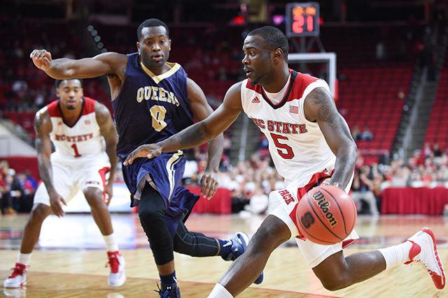 Senior guard Desmond Lee drives to the basket during the exhibition game against Queens (N.C.) in PNC Arena Saturday, Nov. 8, 2014. Lee contributed 8 points and 1 assist to the Wolfpack's 78-47 victory over the Royals.