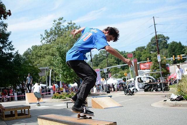 Michael Elliot, a junior studying Agricultural Business Management, shows off a trick during a demo for the Skate Club.