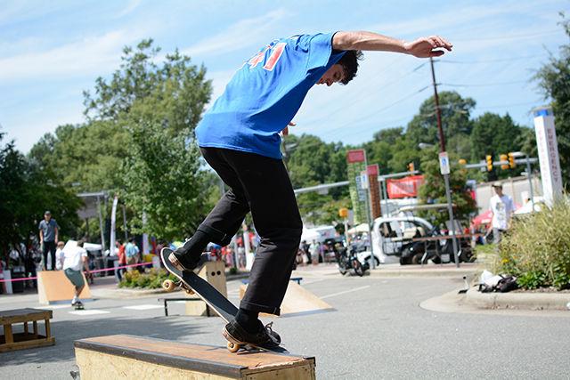 Michael Elliot, a junior studying Agricultural Business Management, shows off a trick during a demo for the Skate Club.