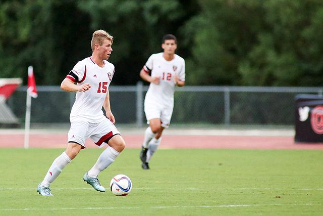 Sophomore midfielder Cameron Steele dribbles the ball during the exhibition against Elon on August 19th in Dail Soccer Stadium. The game was postponed due to inclement weather but will resume on August 20th at 7pm.