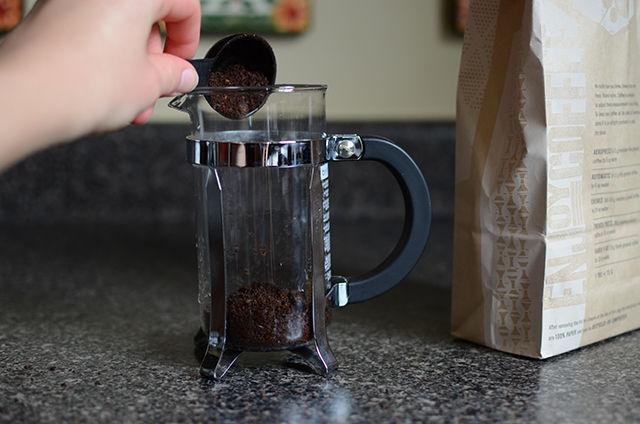 First, add three tablespoons of coarsely ground coffee to the carafe.&#160;
