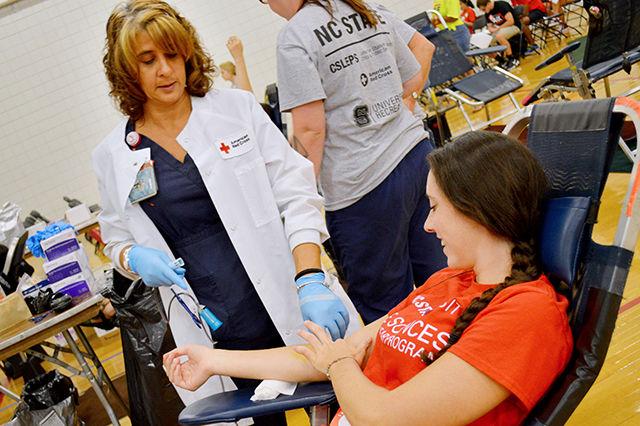 The campus blood drive took place on August 21st at the Carmichael Gym from 8am to 7pm. Volunteer physicians from the American Red Cross Association were there to help registered students give back to their local community. "Today alone, NC State will donate around 1000 pints of blood to the American Red Cross," says Melissa Barnes, director of CSLEPS and chair person of the blood drive. This is the 6th consecutive year that NC State has hosted this blood drive.&#160;