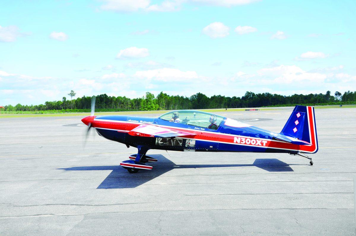 Brett Pierce, also known as, &#8220;The Hammer,&#8221; sits in the cockpit of his plane. According to Pierce, the nickname came from a competition where he broke parts on the plane.