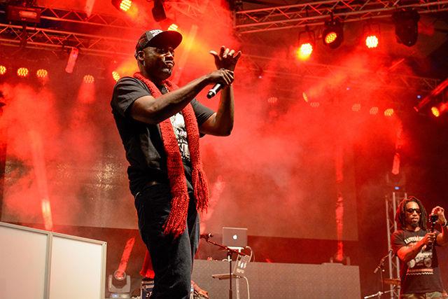 A member of Nappy Roots performs on the main stage.