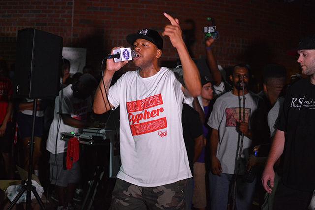 A founding member of NC State's Cypher performs a freestyle rap in front of the Free Expression Tunnel during the NC State Cypher's 5 year anniversary on Monday night.