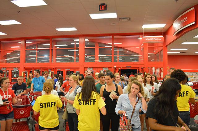 NC State students form a small crowd at the entrance of the Target shopping center as members of UAB swipe ID cards. "The [UAB] board is just super happy to be here!" says UAB member Kamrie Risku, a sophomore studying psychology and political science. "We've been planning this for a while and we are so excited to see it finally in action." By Kristin Bradford