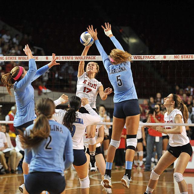 Junior setter Tanna Aljoe spikes the ball against UNC Friday, October 17, 2014. Aljoe had three spikes in the Wolfpack's 3-0 loss to the Tar Heels at Reynolds Coliseum. Photo by Ryan Parry.