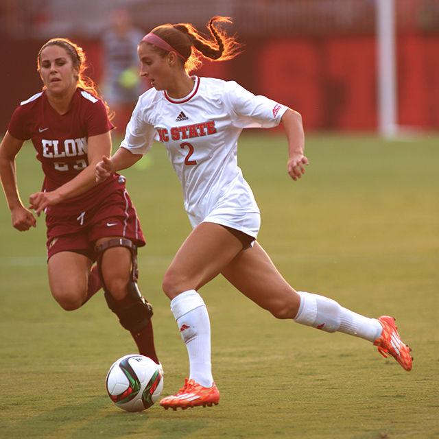 Dayna Tomayko, a redshirt junior defender, carries the ball upfield during the game on August 27th. The Wolfpack beat the Elon Phoenix 2-0 in Dail Soccer Stadium.