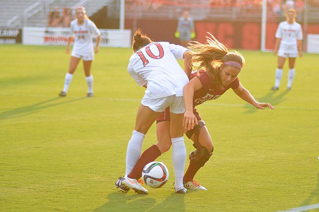 Sophomore midfielder Jackie Stengel, the captain of NC state women's soccer team fights for possesion against the Elon Eagles. Wolfpack won the game 2-0 at Dail soccer stadium on August 27, 2015.