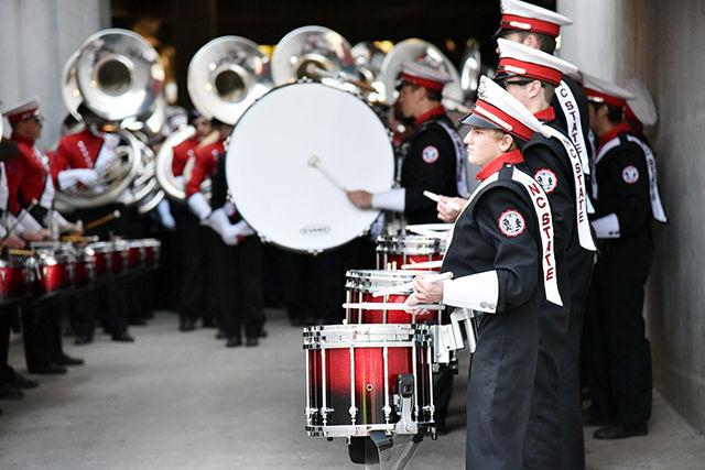 The marching band warms up in the tunnel before taking the field for its pregame routine. Part of the routine includes "Red and White" and "The Star Spangled Banner."