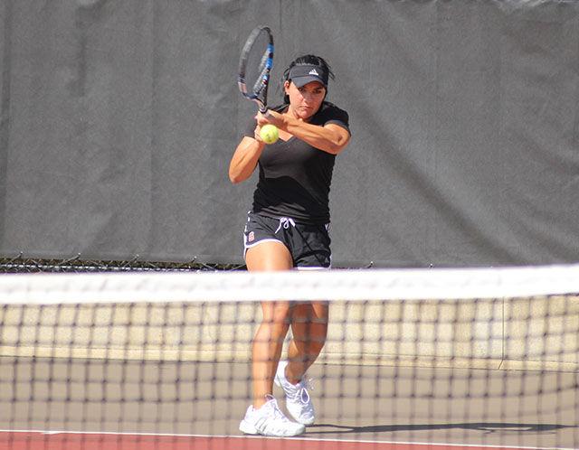 Claudia Wiktorin a Freshman in Design Studies hits a return volley at the Wolfpack Invitational September 13. The three day event featured N.C. State, Georgia State, Mississippi State and Virginia Tech.