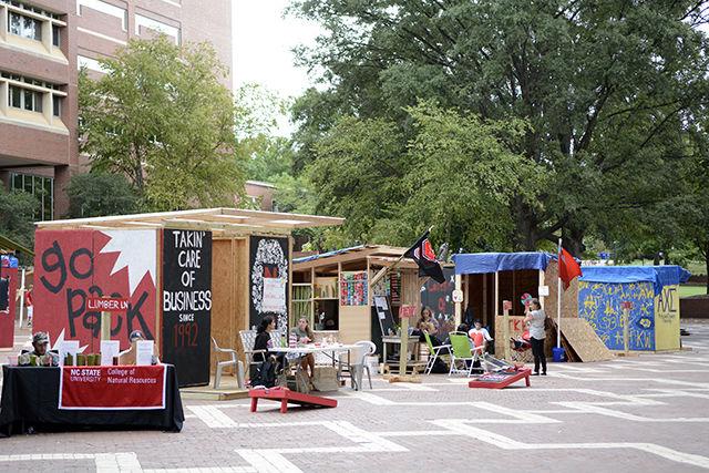 Several students from 23 organizations on campus hunker down in manmade shacks for NC State's yearly tradition of Shack-A-Thon Sept. 22. This year Shack-A-Thon has a goal of raising $65,000 for Habitat for Humanity in order to construct a Habitat home. The shacks raise money by selling baked goods, raffle tickets, student-made products, and a variety of other things.