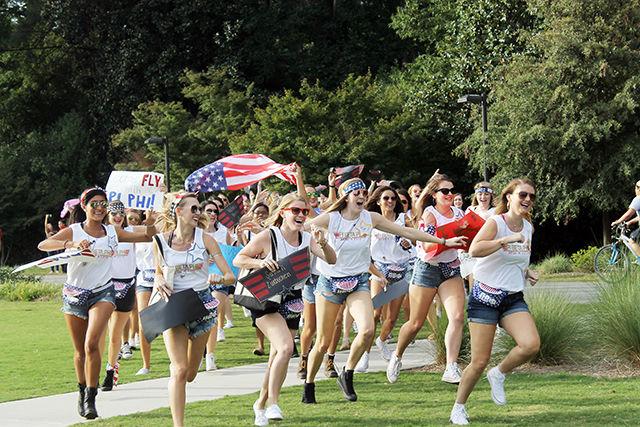 Pi Beta Phi sisters run to welcome their new members. Bid Day, the final event in sorority recruitment, took place on September 16th on Stafford Lawn.