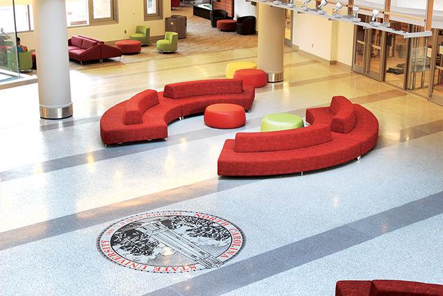 The custom-designed Kontour Three-Seater Sofas from Davis Furniture, the red curved couches located in Talley&#8217;s main lobby, ended up at $18,997.96 each.