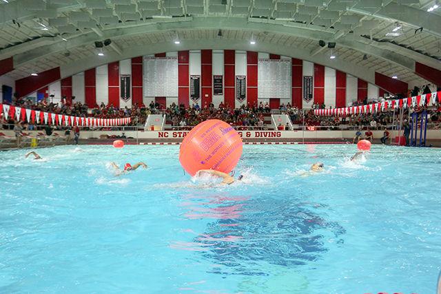 Six women swimmers from the compete in a circuit race as part of the first ever Wolfpack Games. In this race, swimmers completed five laps and had to be the first to jump out of the pool. The Wolpfack Games served as a way to introduce the swimming and diving team to the public for this season on Spetember 25th in the Willis R. Casey Aquatic Center.
