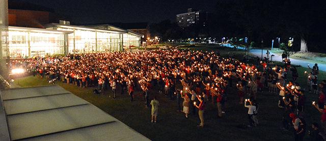 A crowd of over 1300 people holds up their candles in rememberance of Joseph Alexander Banks, a freshman. The crowd had gathered in Stafford Commons (outside of Talley) for the university-held vigil held on Tuesday night.
