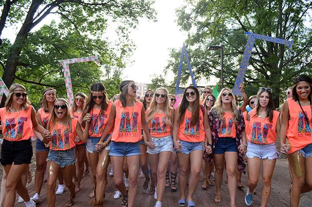The sisters of the Delta Gamma Sorority rush from Tucker-Owen Beach to meet their newly admitted members, who were waiting eagerly on the field in front of the Talley Studet Union.