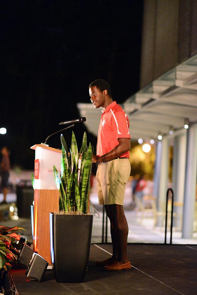 Student Body President Khari Cyrus speaks to about 1300 people gathered on Stafford Commons outside of Talley for a candlelight vigil in memory of Joseph Banks Tuesday night. An impromptu vigil was held on the Brickyard Monday night which drew more tahn 200 people.