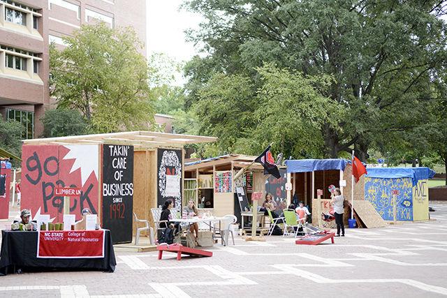 Several students from 23 organizations on campus hunker down in manmade shacks for NC State's yearly tradition of Shack-A-Thon Sept. 22. This year Shack-A-Thon has a goal of raising $65,000 for Habitat for Humanity in order to construct a Habitat home. The shacks raise money by selling baked goods, raffle tickets, student-made products, and a variety of other things.