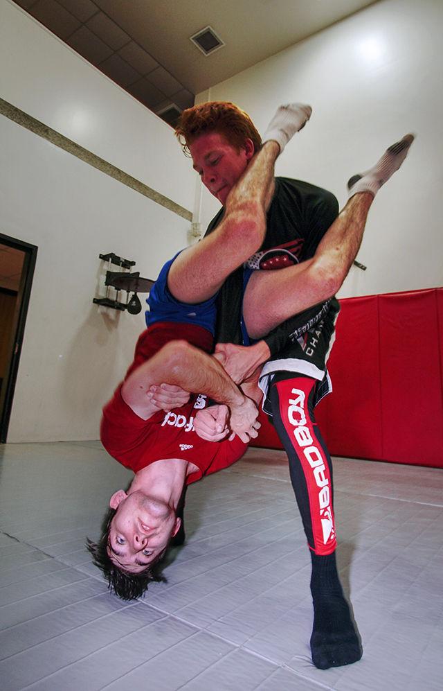 Daniel Goldstein, a senior studying aerospace engineering, demonstrates an armlock technique on Nick Hill, a freshman studying aerospace engineering. This was during a practice of the Brazilian Jiu Jitsu club on Monday, Sep. 7 in the Carmichael Combat Room.