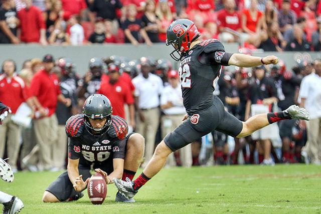 Freshman placekicker Kyle Bambard kicks an extra point after Samuels ran for a touchdown against the Colonels. Bambard was 4 for 4 on extra points on the night and had a field goal attempt blocked. The NC State Wolfpack shutout the Eastern Kentucky Colonels 35-0 in Carter-Finley Stadium on September 12th, 2015.