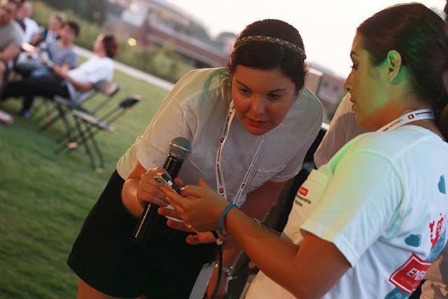 Megan Greer, Director of Communications and outreach and Macy Thomas, Communications specialist at Entrepreneurship Initiative anxiously look forward to the result of "Minute to Pitch it" event during Entrepalooza at The Oval on Thursday, Sept 3, 2015.