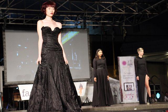 A model looks all regal in the beautiful black dress designed by Zachary/Nathaniel while walking the ramp at Fashion Spark on Saturday, September 19, 2015. Fashion Spark is a part of SparkCon, the annual street art festival of Raleigh.