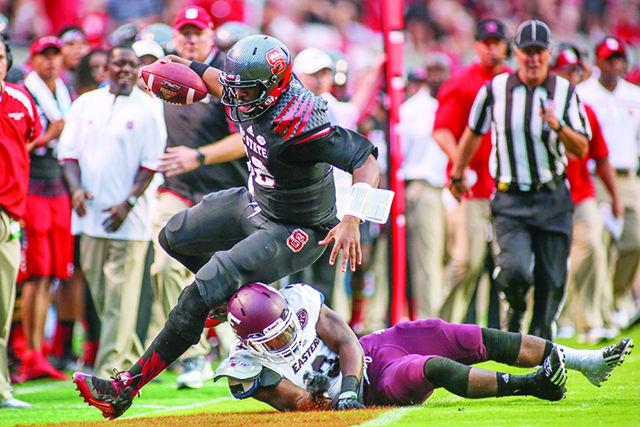 Redshirt senior Jacoby Brissett rushes to the edge against the Eastern Kentucky defense. Brissett threw 17 for 22 with 216 yards in the 35-0 shutout against the Eastern Kentucky Colonels in Carter-Finley stadium on September 12th.