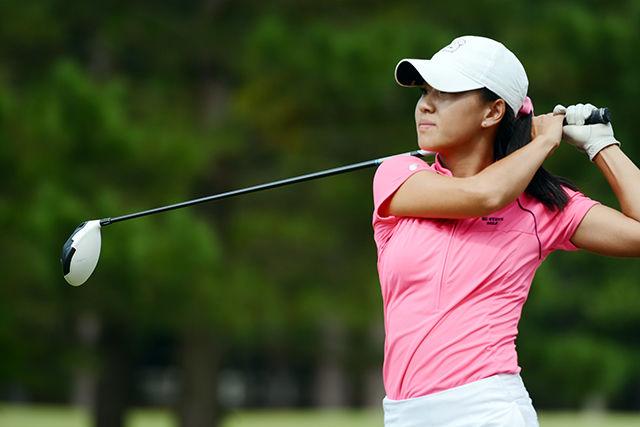 Senior Vivian Tsui watches her ball fly down the fairway of hole 9 Saturday, Oct. 11, 2014, during the Ruth's Chris Tarheel Invitational at Finley Golf Course in Chapel Hill. Tsui finished 46th overall in the tournament shooting 76-74-77 over three days. The team finished third overall behind Duke and South Carolina.&#160;