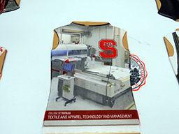 A design printed by the new digital textile printer. A ribbon cutting ceremony was held on Wednesday to unveil the new machine, the first model used in the United States. A demonstration of the system&#8217;s capabilities showed that the new machines are capable of printing complex designs onto natural and synthetic fabric at a rate of 100 meters per hour using four colors and 50 meters per hour using eight colors; a fraction of the time it used to take to produce comparable goods in the past.