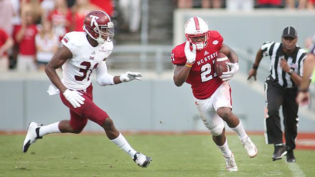 Junior running back Matt Dayes makes a rush to the sideline during the home opener against Troy on September 5th. Dayes perfomed strongly during the game with 29 touches on 191 yards. The Wolfpack thoroughly romped Troy 49-21 in the home opener in front of a crowd of 57,000 in Carter-Finley Stadium