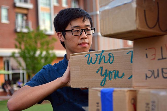 Ren Zhong, a student studying physics enjoys a game of jenga with his friends at the entrepalooza festival held on Thursday, September 3rd at the oval in centennial. Ren and his friends managed to build a 18 stories tall tower before the tower got knocked by the wind. Entrepalooza, an entrepreneurship and innovation festival was hosted by the NC State Entrepreneurship Initiative and featured many activities such as minute to win it pitch, innovation lab, games, prize wheel and free food!