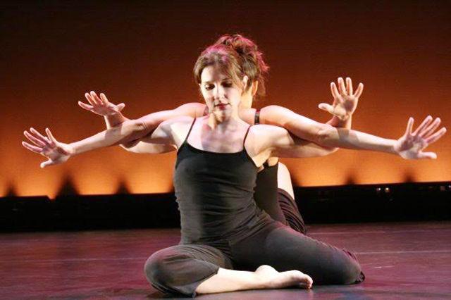 &#160;
Tara Z. Mullins, the assistant director of the NC Dance Program and artistic director of Panoramic Dance Project, dances on stage with her partner, Kendall Neely.